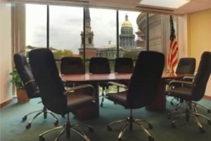 A board room with table and chairs